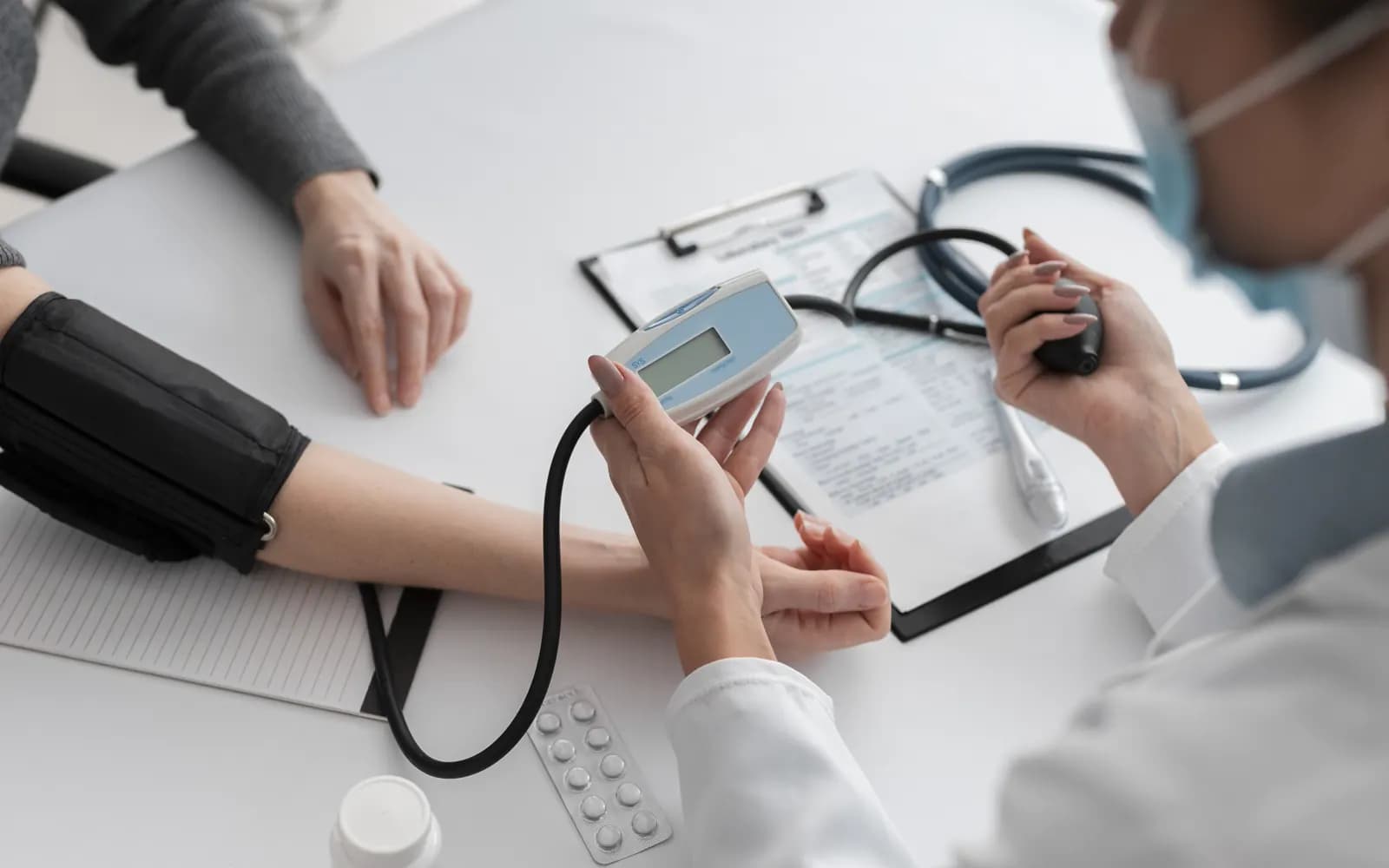 Healthcare professional measuring a patient's blood pressure